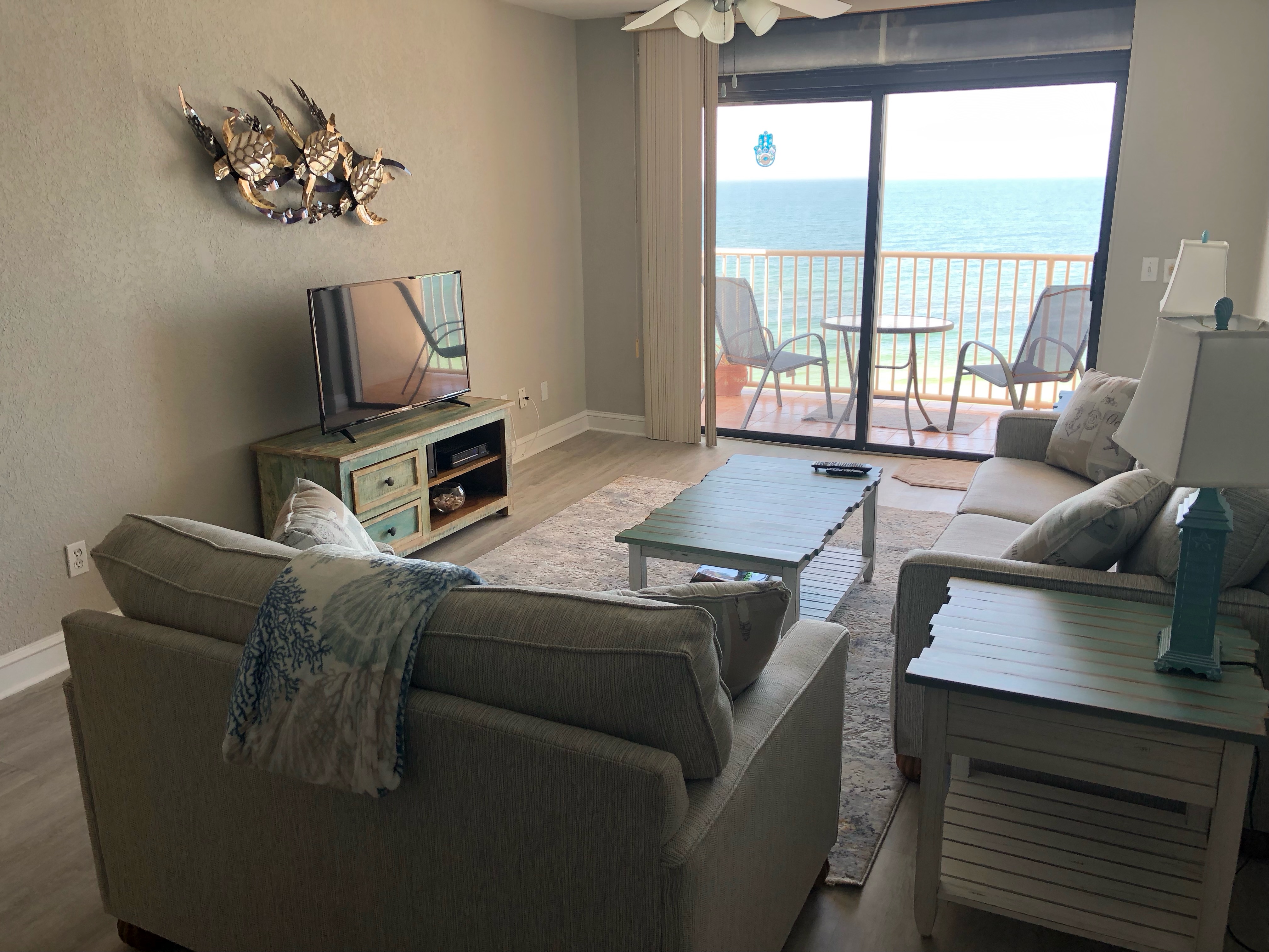 Luxury Gulf front living room with panoramic beach views in Indian Shores, Florida