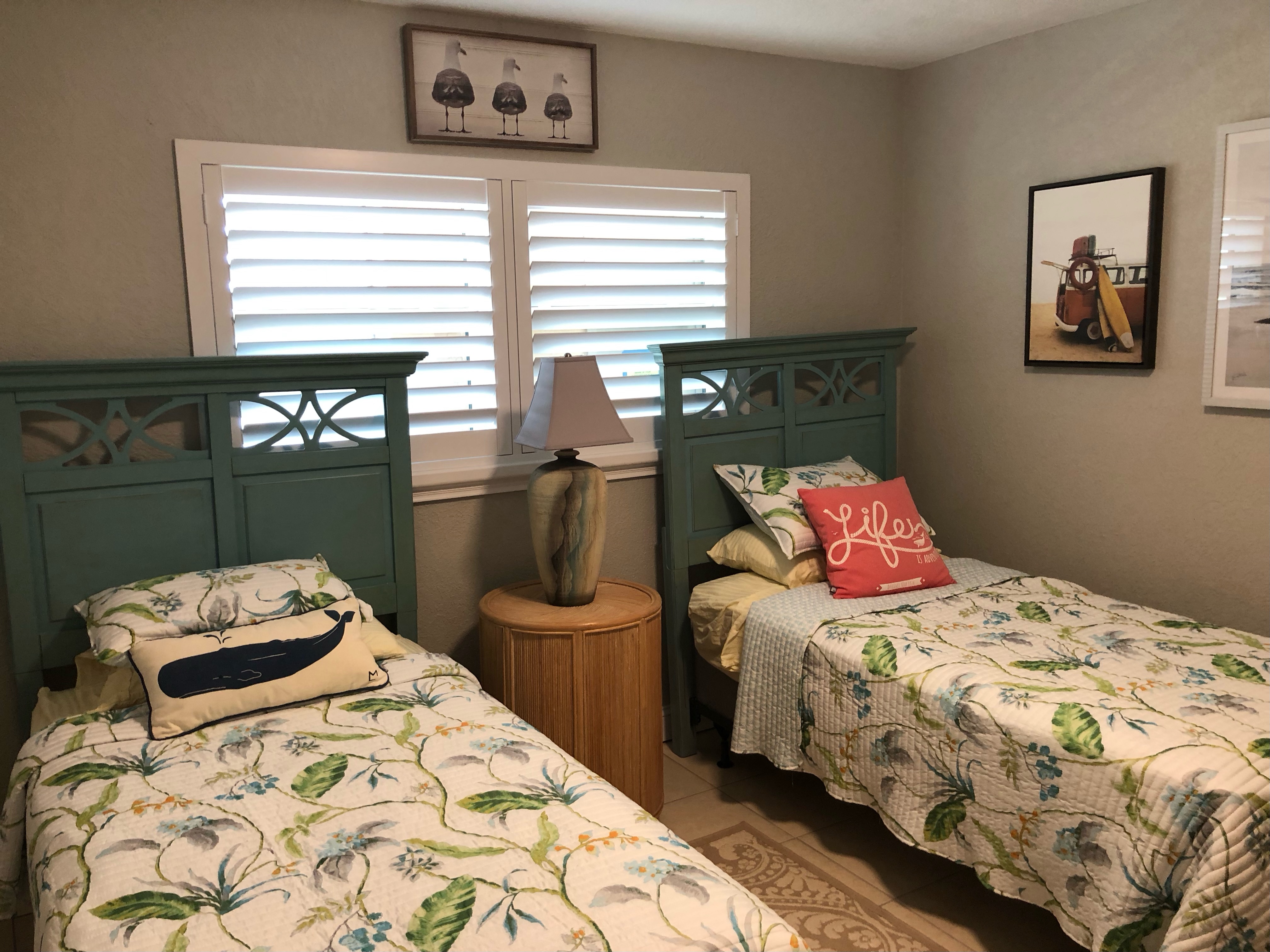 Guest bedroom with view of the intercoastal and two comfortable twin beds, closet for storage and TV