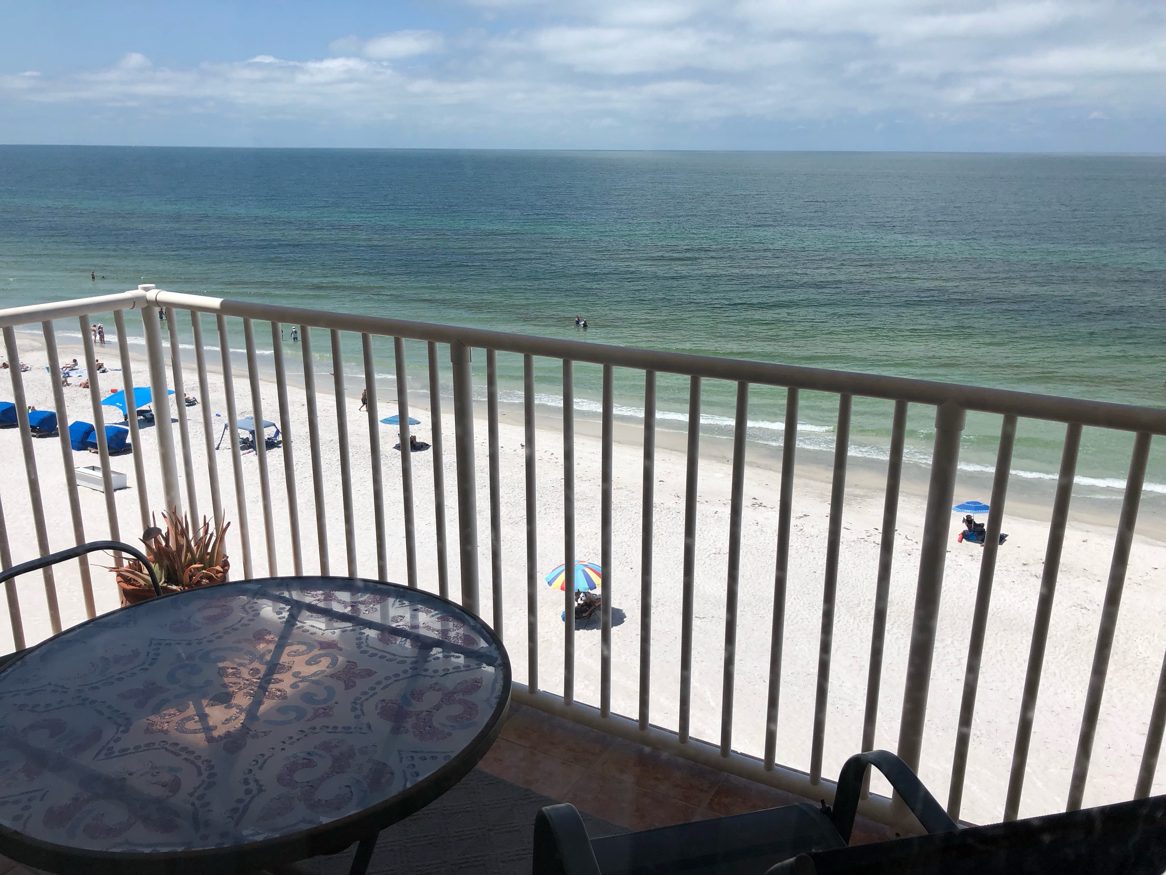 Shaded balcony with a table and 2 chairs to enjoy the sunset view with a glass of wine